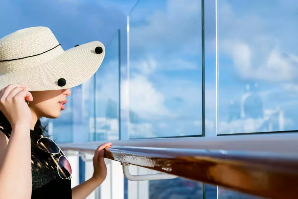 attractive-carefree-asian-female-woman-casual-cloth-smile-relax-pleasure-vacation-time-cruise-ship-balcony-with-blue-sky-cloud-background-1-1024×683