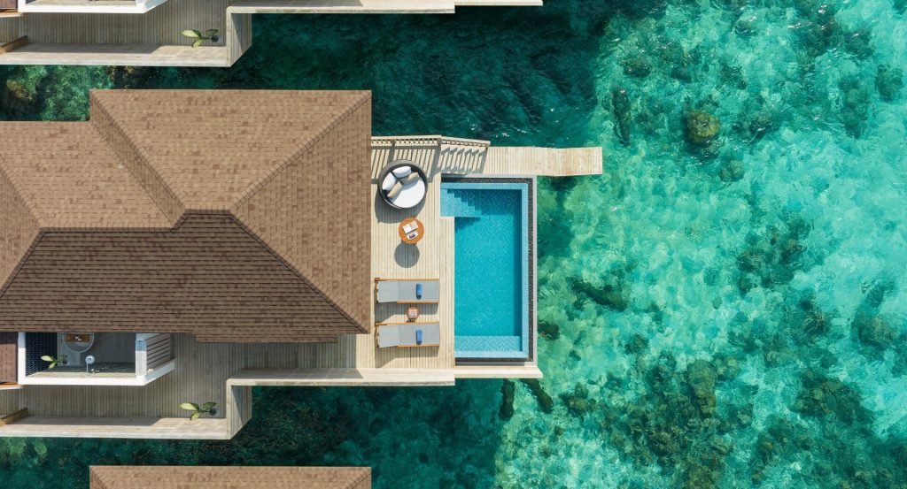 avani_sunset_over_water_pool_villa_aerial_view_avani_plus_fares_maldives_resort_1920x1037